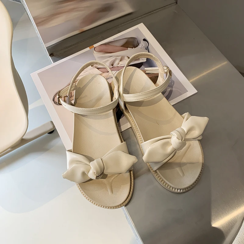

Сандалии Женские однотонные на плоской подошве, пляжные босоножки с ремешком, популярная повседневная обувь с бантом, Сказочная обувь в рим...