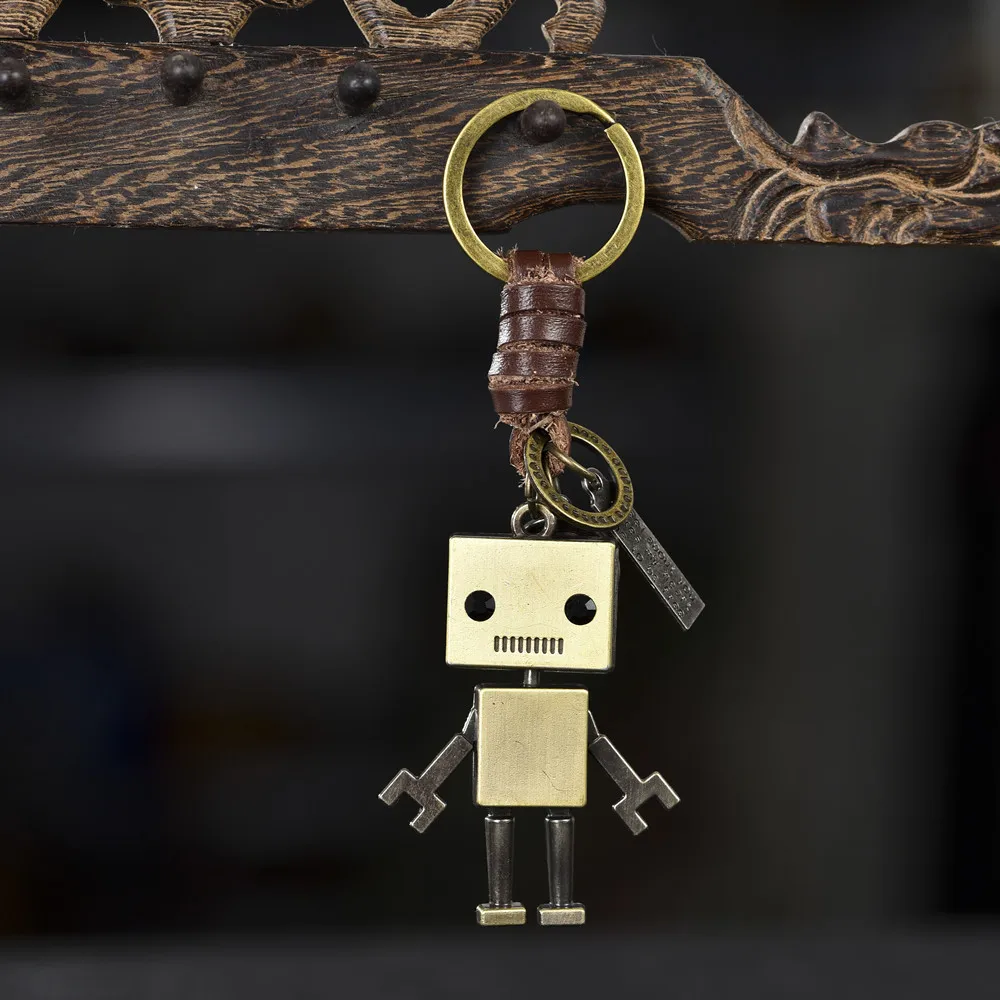 Simple cartoon cute robot cowhide keychain personalized retro woven key pendant creative bag pendant