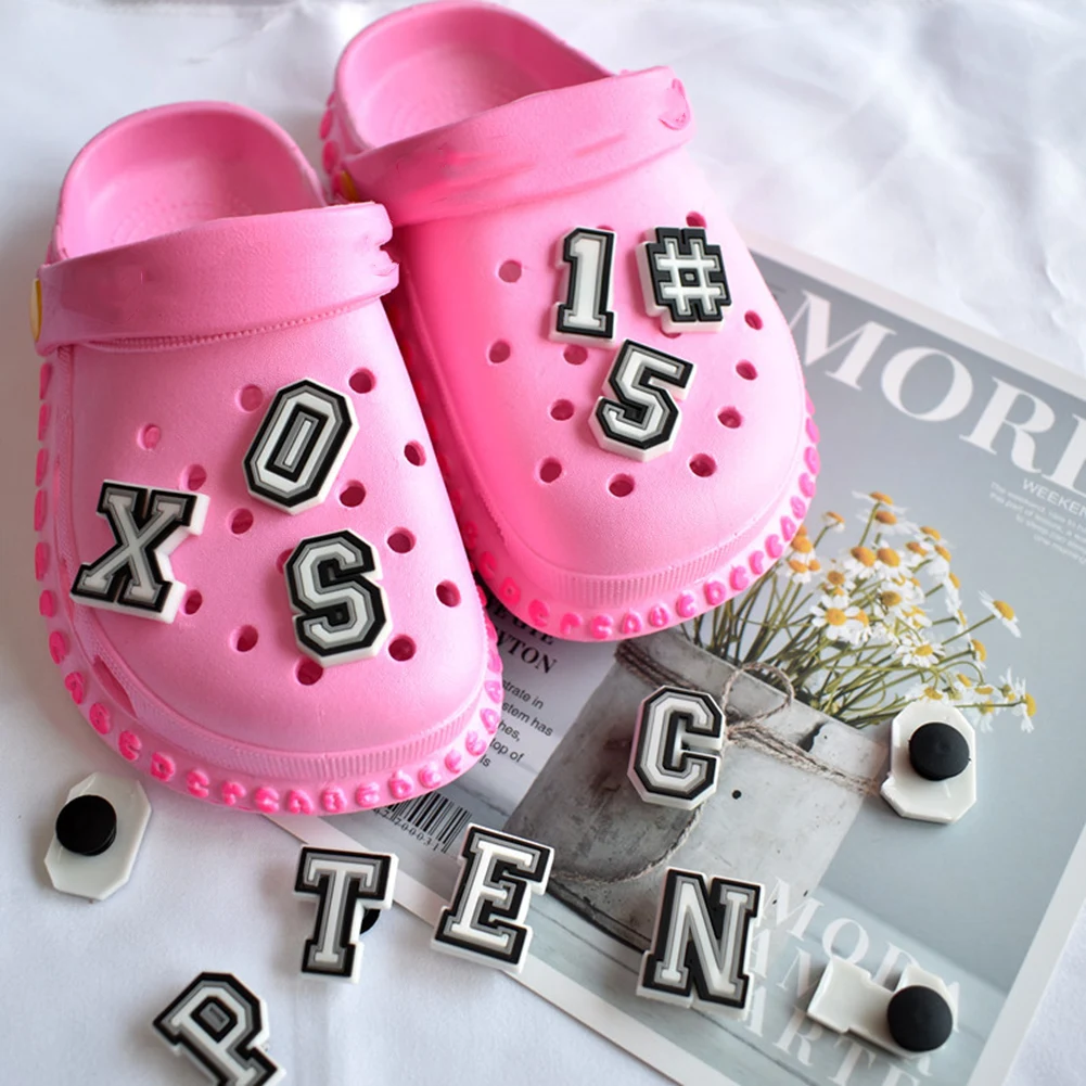 

Hot Selling 1PCS Black White Alphabet Shoes Charms PVC Accessories Kids X-mas Gifts DIY Wristband Hole Slipper Decor