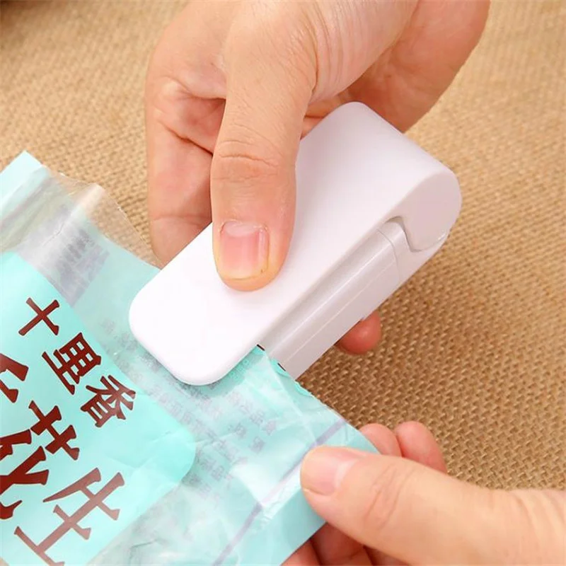 

Portable Bag Heat Sealer Plastic Package Storage Bag Clip Mini Sealing Machine Handy Sticker Seal for Food Snack Kitchen Gadgets