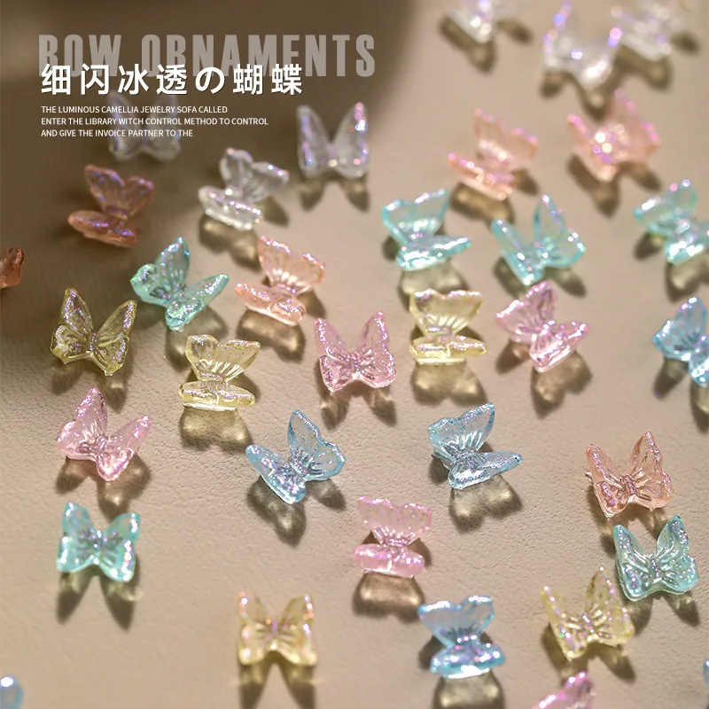 

100pcs Ice Transparent Butterfly Resin Stone Nail Rhinestones Aurora 3D butterflies Charms Decoration DIY Nail Jewelry Accessory