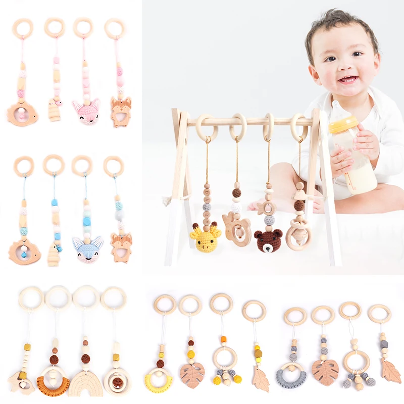 

4 Pcs/Set Baby Gym Frame Stroller Hanging Pendants Wooden Ring Teether Molar Teething Nursing Rattle Toys Gifts Infant Room Deco