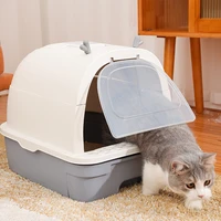 the cat litter box is fully enclosed oversized odor proof and spatter proof open and closed dual use two way door cat toilet