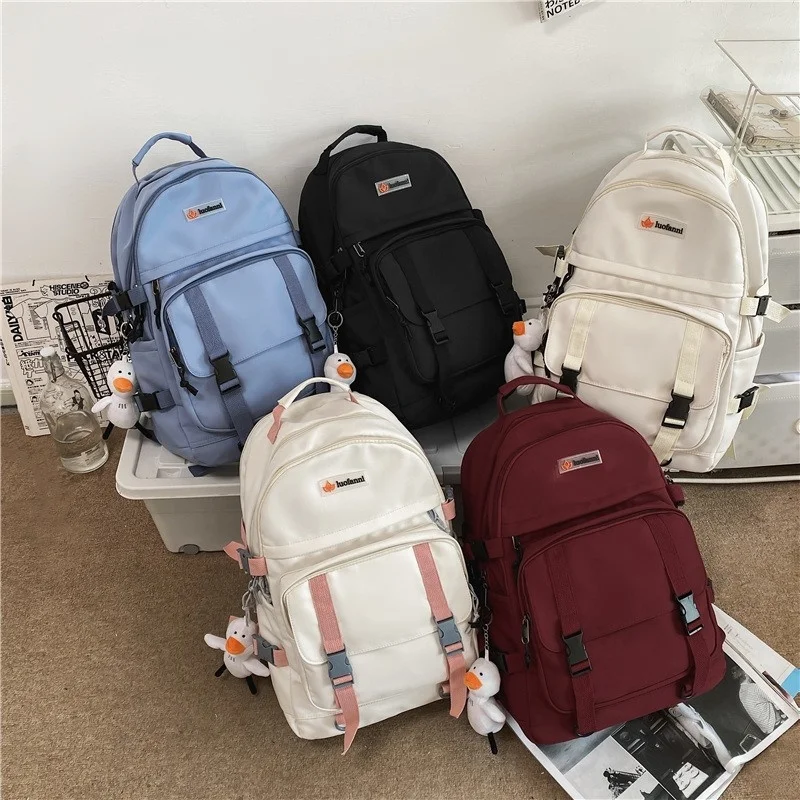 

Japanese Cute Pendant Women Backpack Multi-compartment Unisex School Backpacks Large Capacity Travel Backpacks Nylon Bookbags