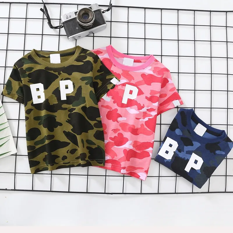 

Модная новинка, детская камуфляжная рубашка для мальчиков и девочек, летние короткие рубашки с мультяшным рисунком животных, топы, футболка...