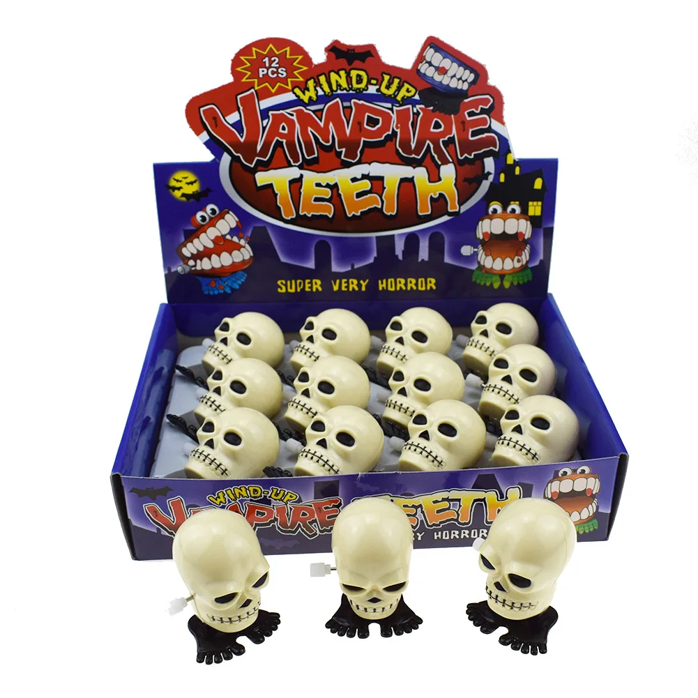 

Novelty and Interesting Winding Spring on The Chain White Jumping Skull Head Halloween Christmas Small Gift Toy
