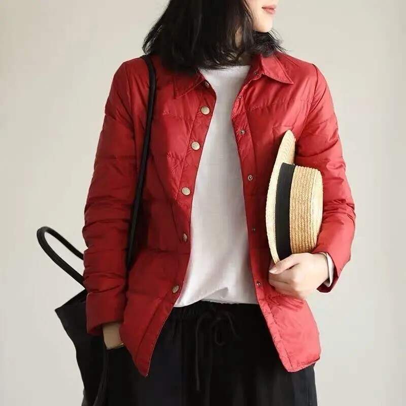 Осенне-зимняя женская куртка с перьями