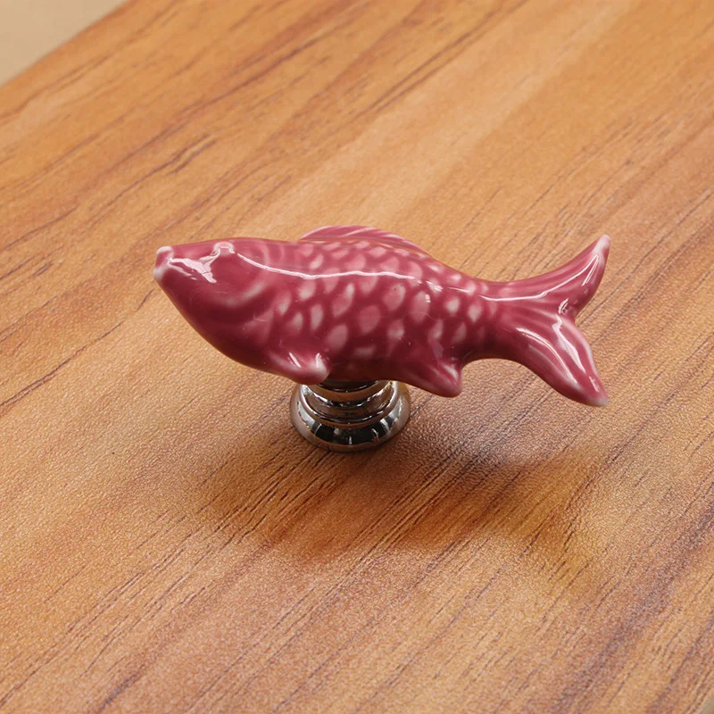 

Керамическая дверная ручка золотая рыбка