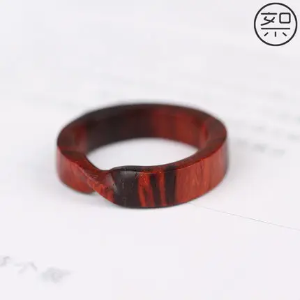 

Delicate lobular rosewood Mobius ring
