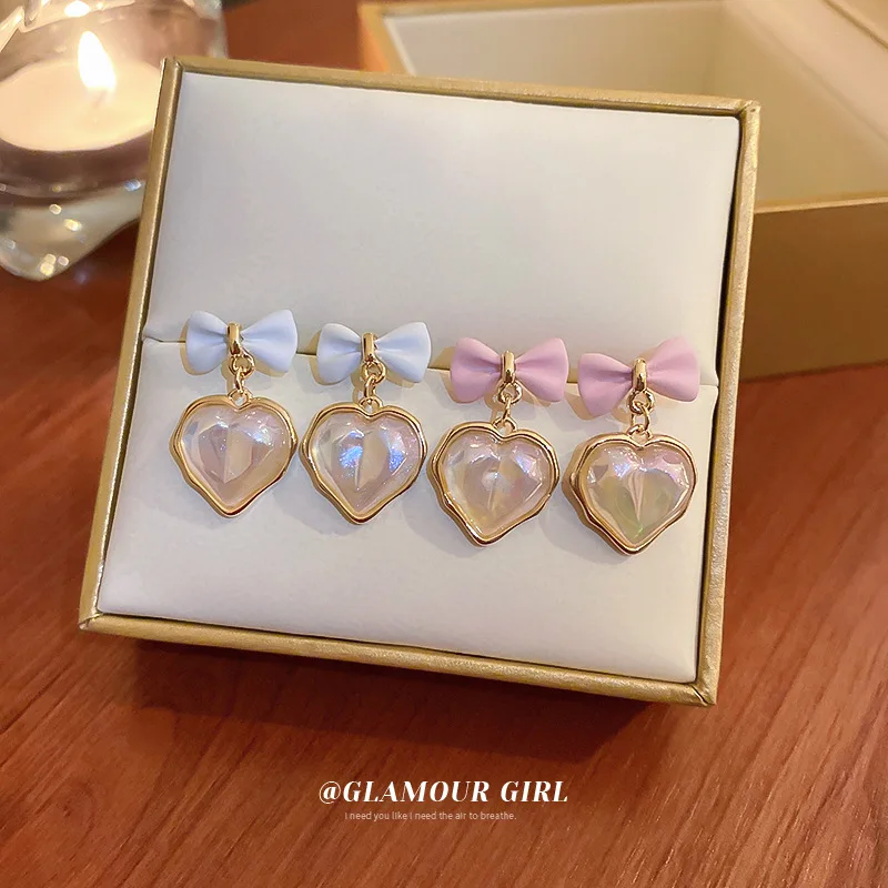 

Korean fashion temperament bow Mermaid Ji pearl earrings simple and versatile girl love ear jewelry