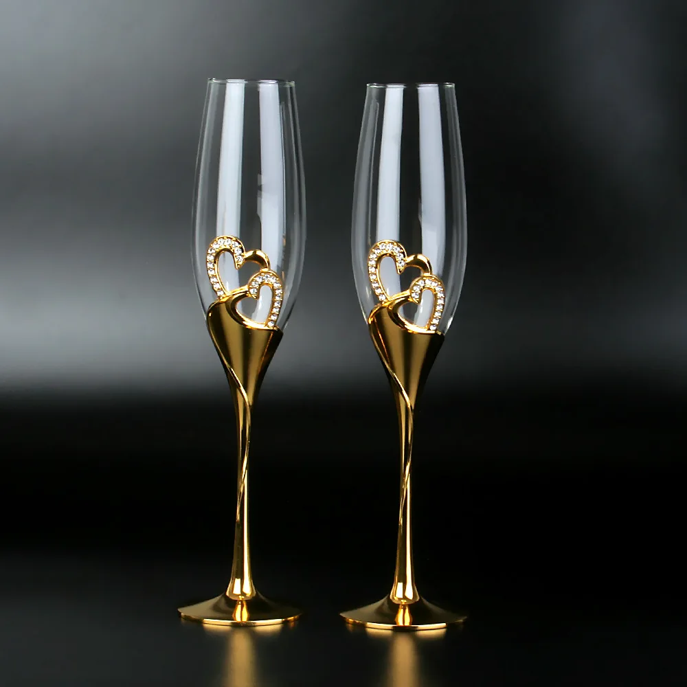 

Two gold champagne glasses in a boxed crystal high-footed cup Wedding gift to cup high-footed cup sparkling wine glass