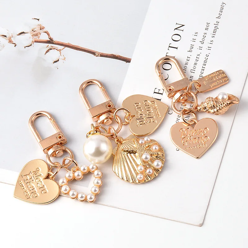 

Cute Pearl Shell Keychain Pendant Ins Metal Jewelry Creative Small Gift Airpods Pendant Wholesale