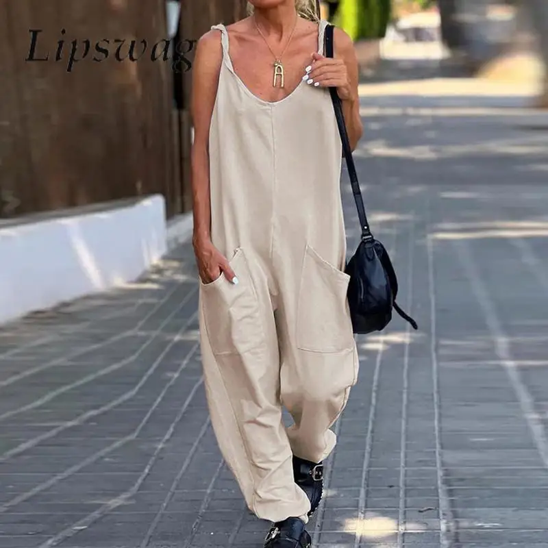 

Casual Lady Solid Color Loose Jumpsuit Women Summer Sling Vacation Beach Playsuit Solid Color Pocket Pencil Pants Romper Overall