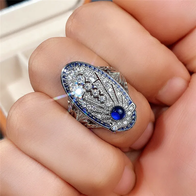 

2022 New Copper Inlaid Zircon Retro Temperament Ring Hollow Palace Style Sapphire Blue Zircon Ring Wedding Anniversary Gift