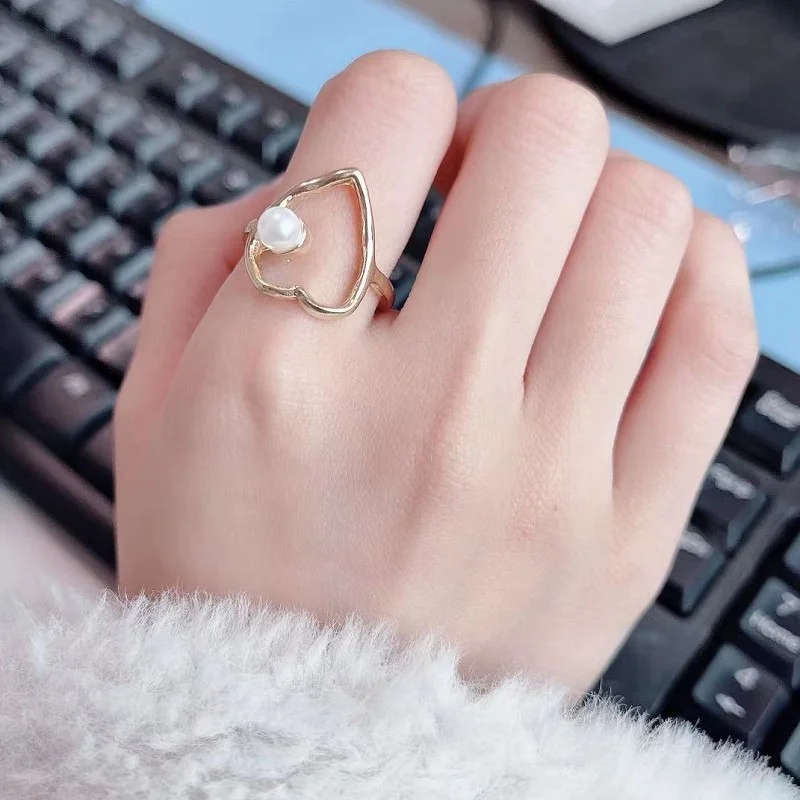 

New simple peach heart hollowed out ring fashion pearl love couple ring