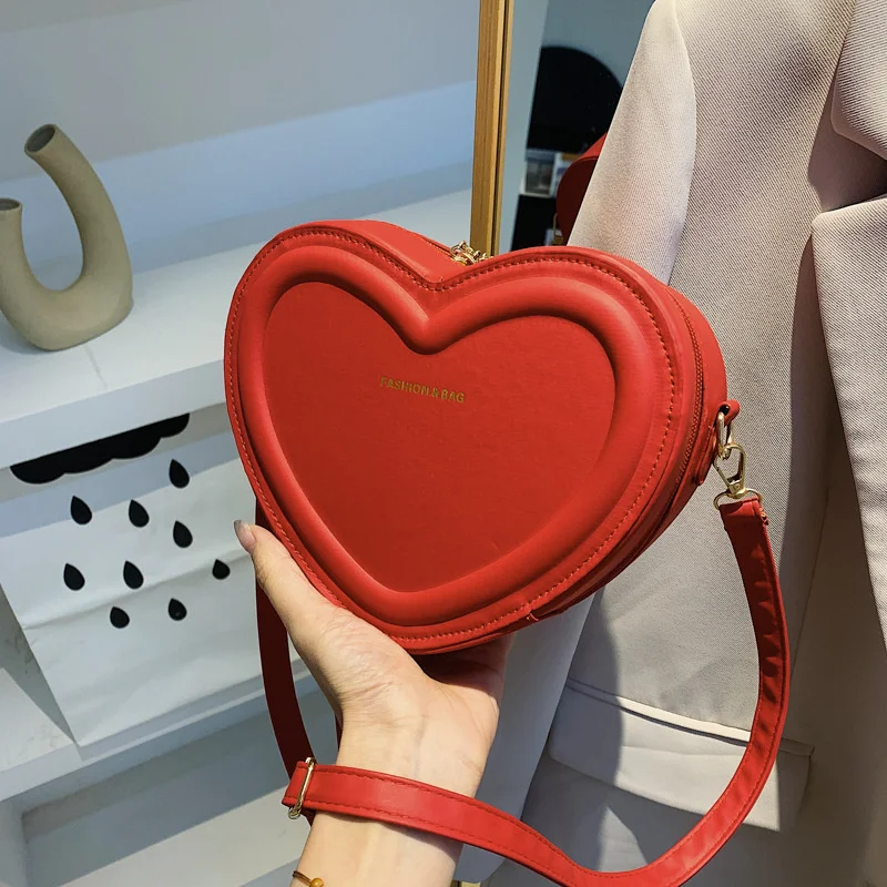 

Cute peach heart small bag women 2022 new fashion messenger personality ins simple texture foreign style shoulder bag