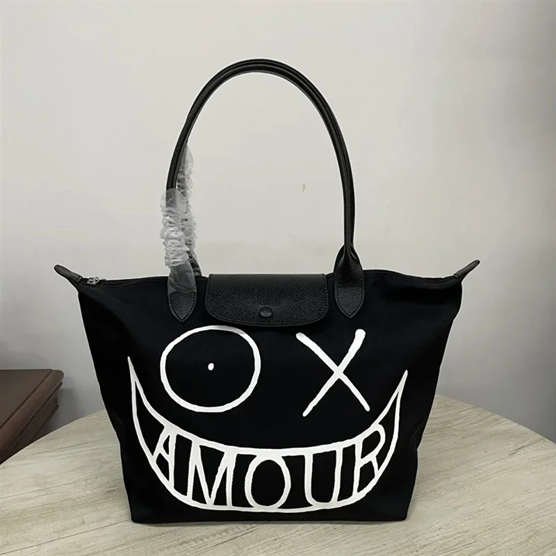 

2023 New Black Graffiti Bag Expression Pack Shoulder Slung Folding Handbag Nylon Jiaozi Bag Shopping Bag Bags for Women