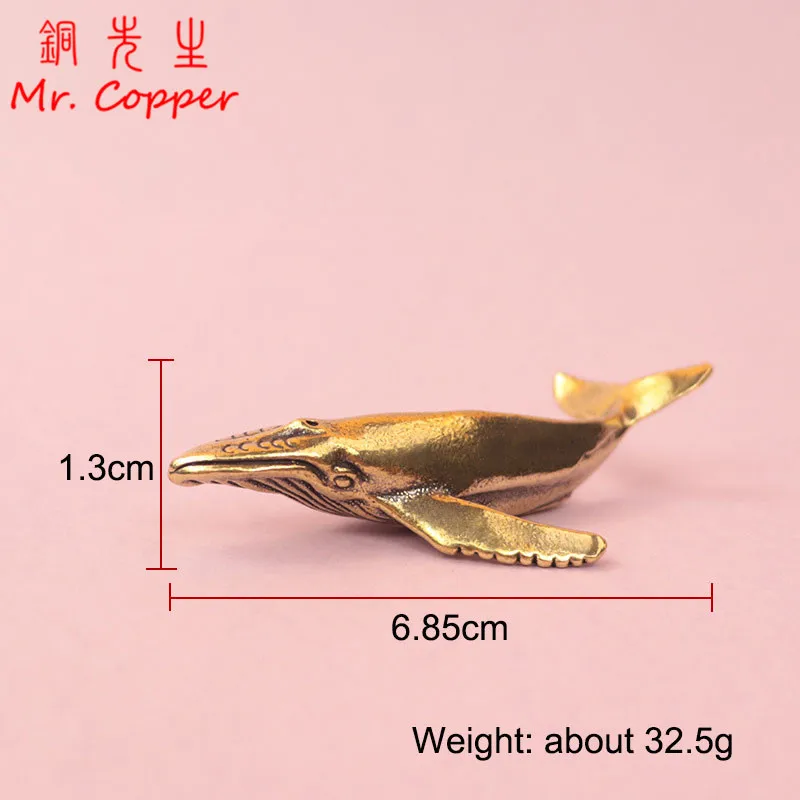 

Статуэтки китов из латуни