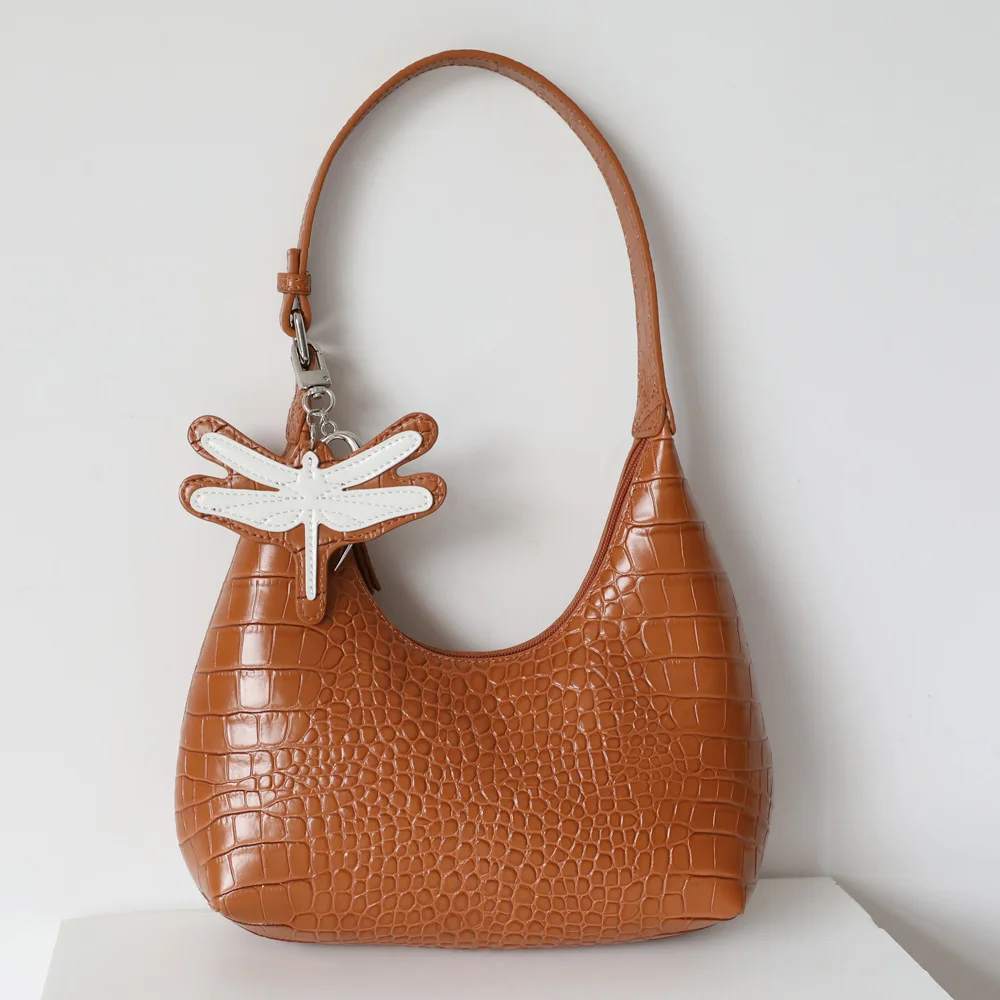 

2022 New Niche Dragonfly Pendant Hand-held Leather One-shoulder Armpit Bag Crocodile Dumpling Bag Crescent Bag Woman