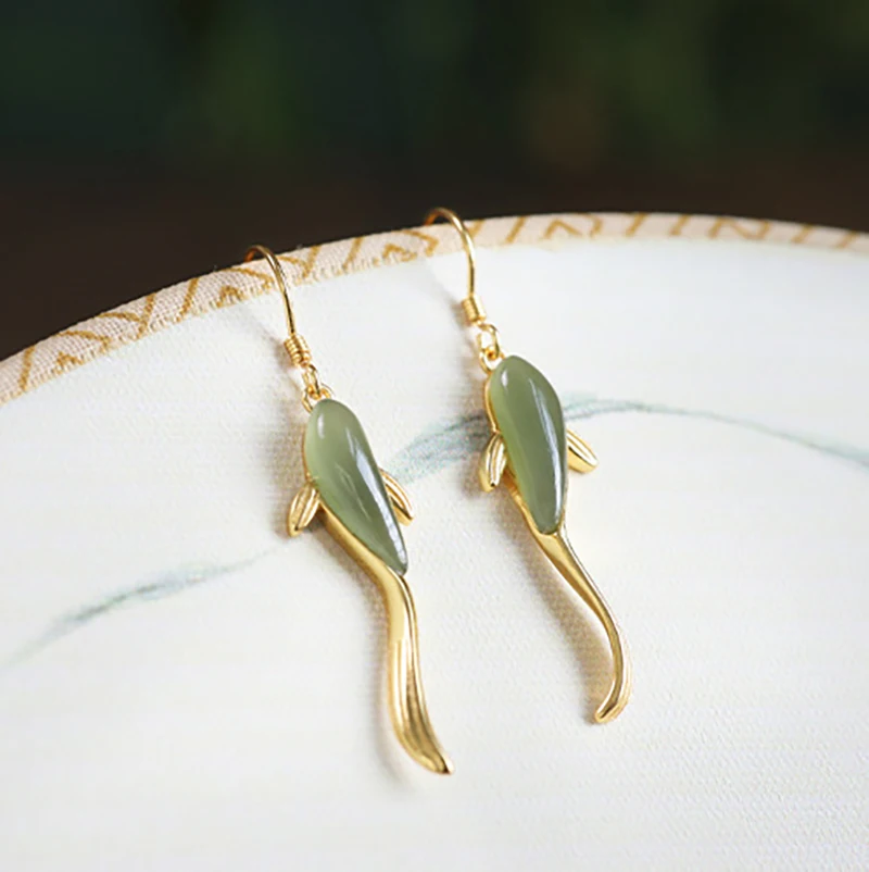 

New women's golden personality jade swimming fish pendant earrings fashion trend jewelry gift es565