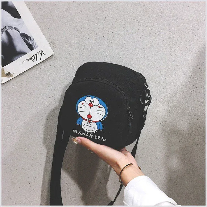 

The New Doraemon Cartoon Cute Canvas Bag Super Cute Shoulder Bag Men and Women Fashion Jingle Cat All-match Messenger Bag