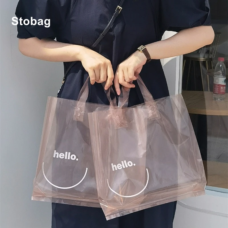 

StoBag 10pcs Transparent Plastic Woman's Shopping Tote Bags Smile Clothing Packaging Big Portable Reusable Store Logo Wholesale