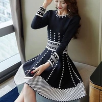 2022 new knitted dress autumn and winter womens mid length waist tight temperament slimming and fashionable small black dress