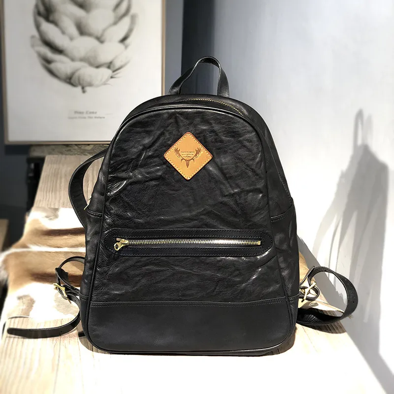

Vintage fashion luxury desig natural real leather ladies folds black color backpack teenage girls travel High capacity backpack