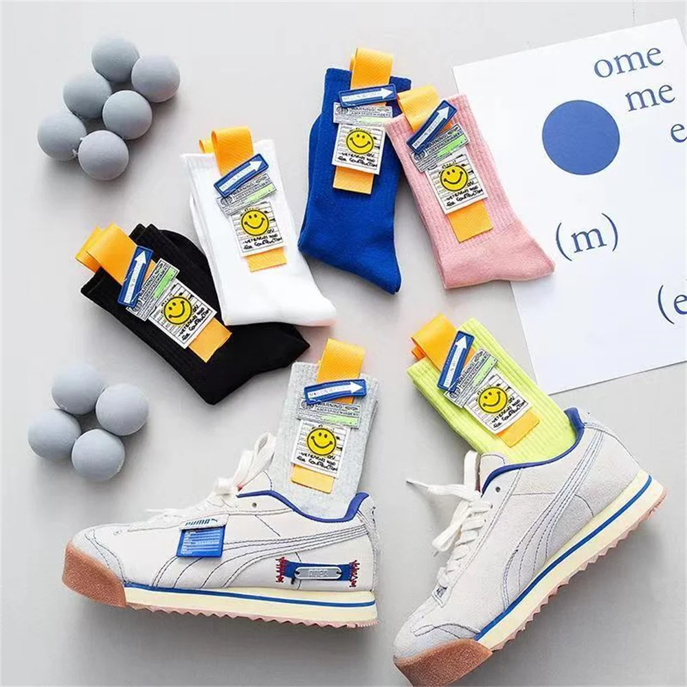 Cartoon smiling face fashionable fluorescent color medium tube socks Street hip hop basketball skateboard socks four seasons