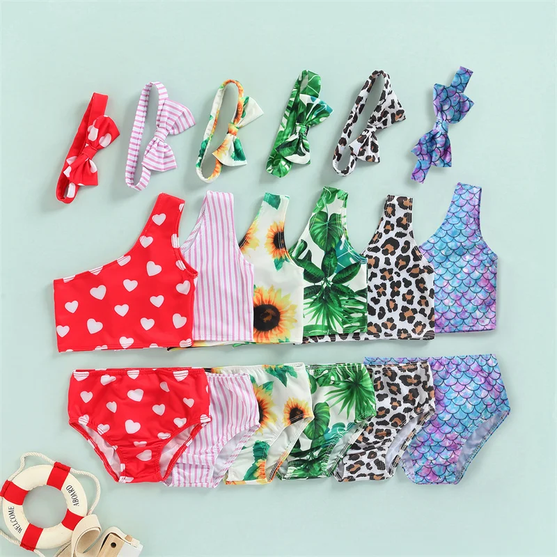 

Baby Girls Swimwear Tankinis 3Pcs Printing One Shoulder Tops Shorts and Bow Hairbands Cute Beach Swimsuits for Kids 2-8 Years