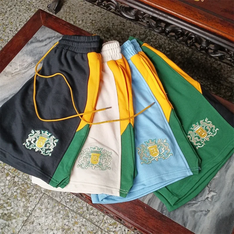 

High quality cotton casual shorts Rhude Embroidered Badge Shorts Men Women Yellow Drawstring Patchwork Shorts Breeches Gym