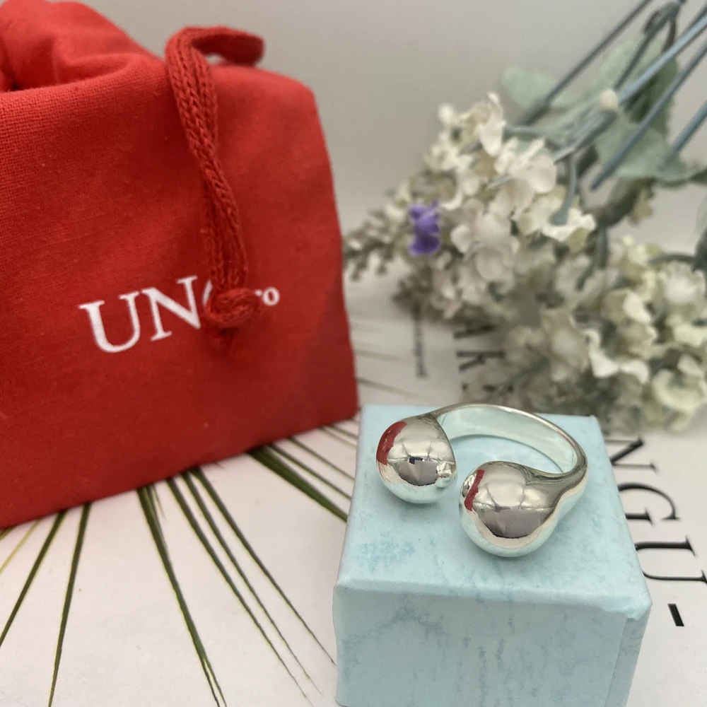 

Новинка 2023 г., серебряное кольцо для наушников в форме кольца, модное простое высококачественное женское Универсальное кольцо для свиданий и путешествий, подходит для UNO DE 50