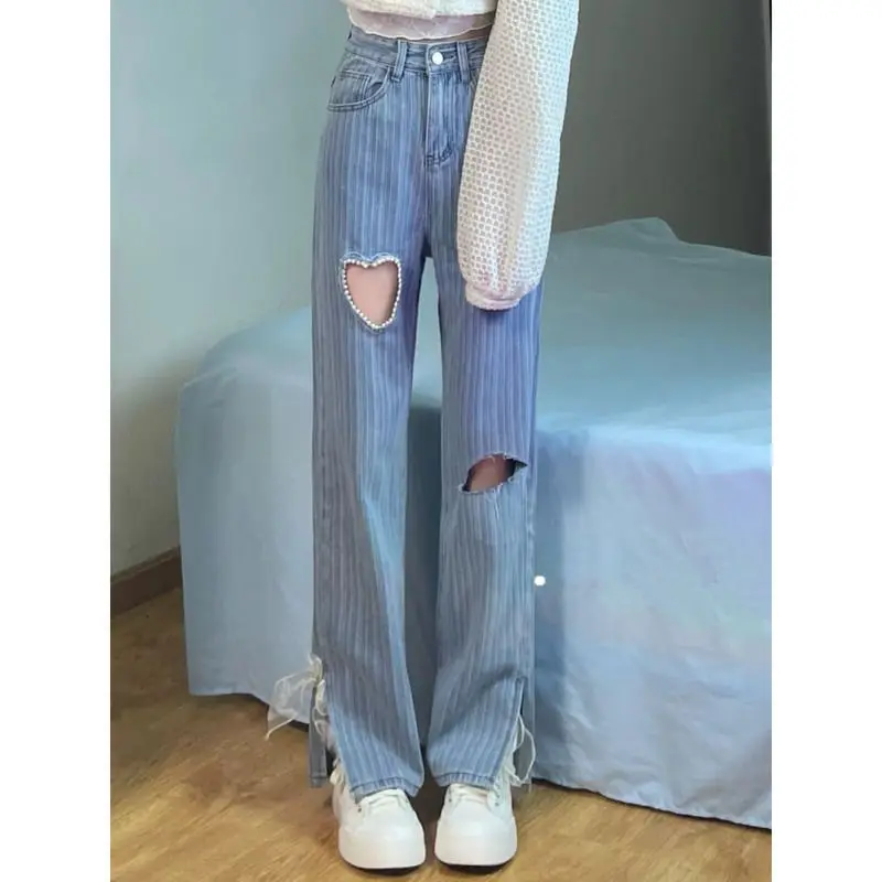 

Korean chic design sense love hole jeans female summer 2022 new sweet and spicy niche with a hundred straight pants XL