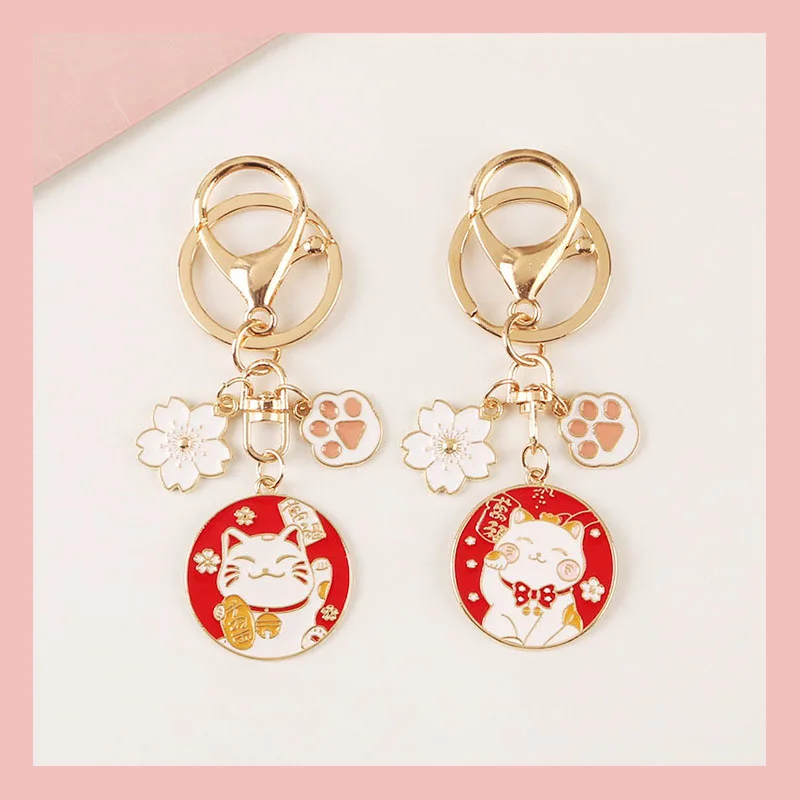 

Cute Fortune Cat Keychain Maneki Neko Cat Pet Paw Sakura Original Keyring Wholesale Car Keychains Charms Pendant Student Gift