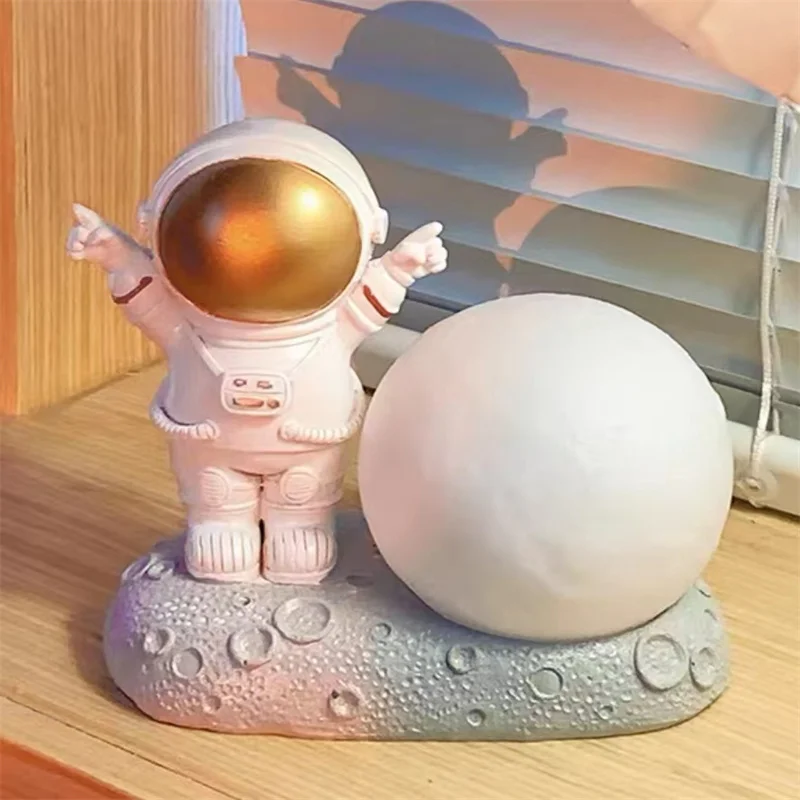 

Creative Astronaut Mobile Phone Rack Home Decoration Kick Shape Car Accessories Indoor Small Sculpture Children Gift