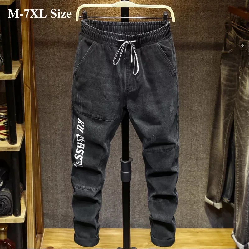 

2022New Size 5XL 6XL 7XL Men Stretch Waist Black Gray Jeans 2020 Autumn New Fashion Letter Printing Denim Harem Pants Male Brand