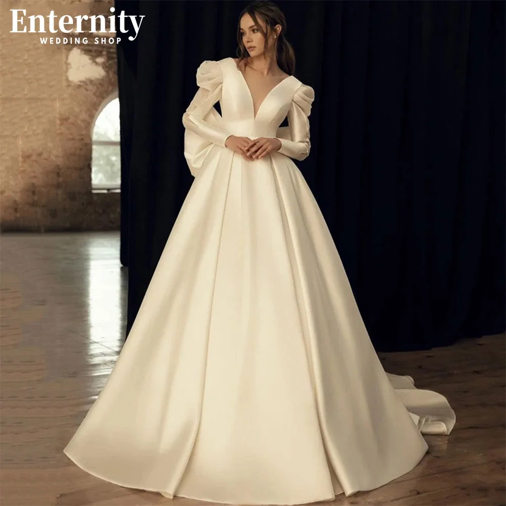 

Demure Deep V Neck A Line Wedding Dress Long SleevesOpen Back With Bow Bridal Gown Court Train Simple Vestidos De Novia