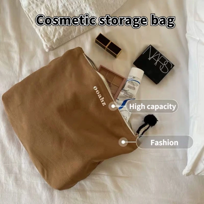 

Small Hair Ball High-end Cosmetic Bag Large-capacity Letter Clutch Bag Canvas Bag Storage Bag Simple Fashion Storage Bag