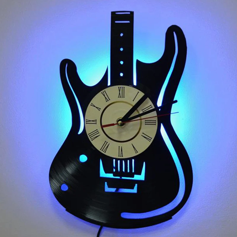 Включи музыкальные часы. Часы в виде гитары. Часы музыкальные настенные. Часы настенные в виде гитары. Часы для музыканта настенные.