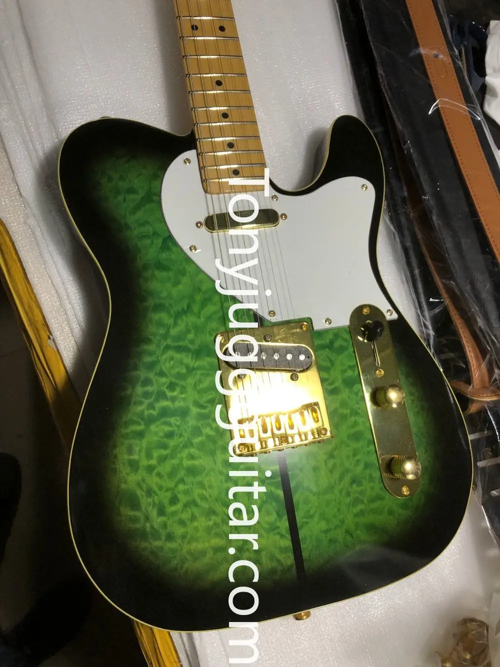 

Merle Haggard Tuff Dog Tele TL Green Burst Quilted Maple Top Electric Guitar Maple Neck, White Pearl Tuners, Gold Hardware