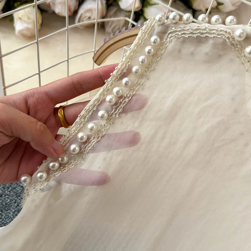 Женская свободная кофта без рукавов с круглым вырезом и бриллиантами