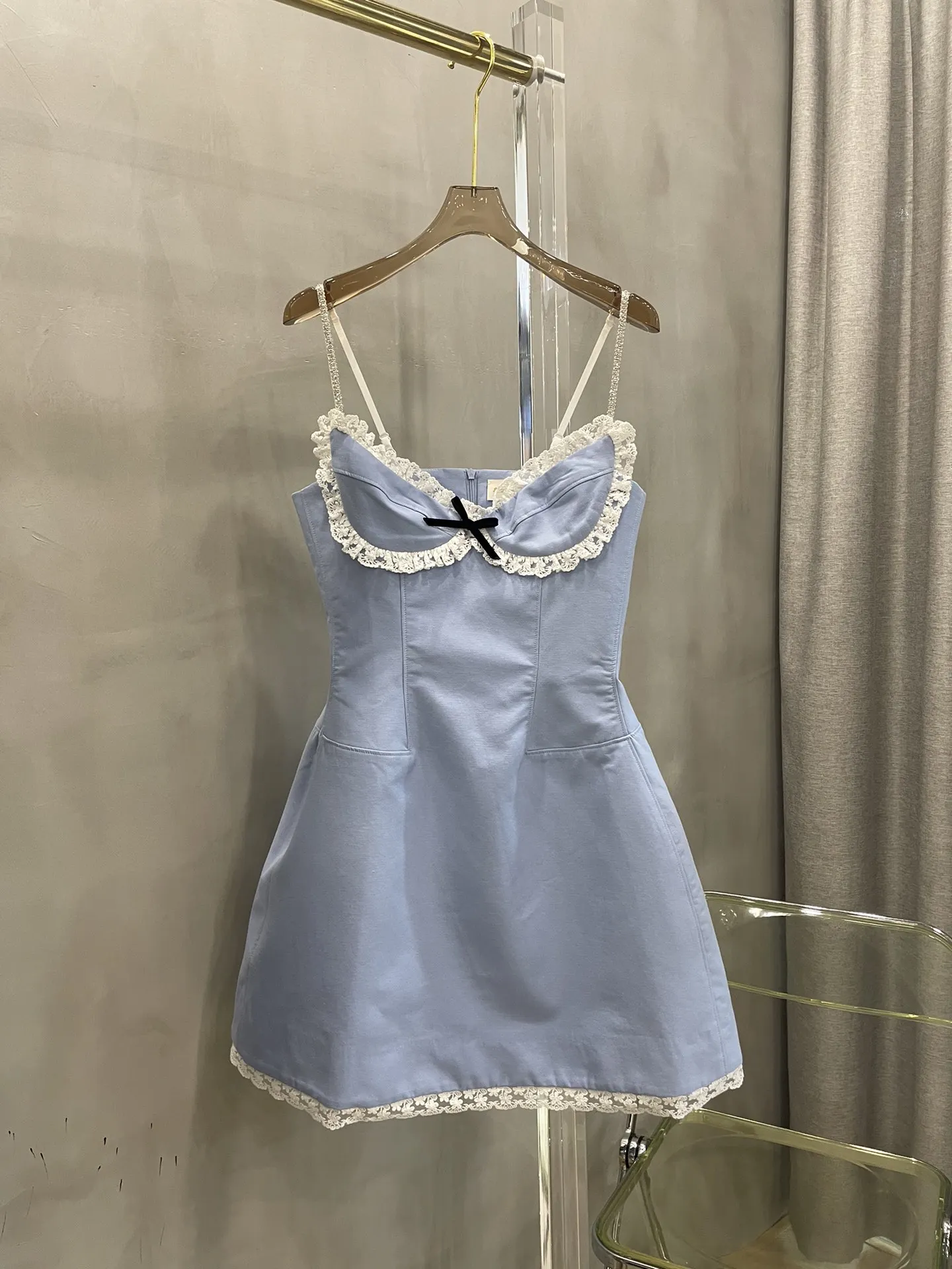 

Light blue dress with lace flowers to outline the line is very understand women