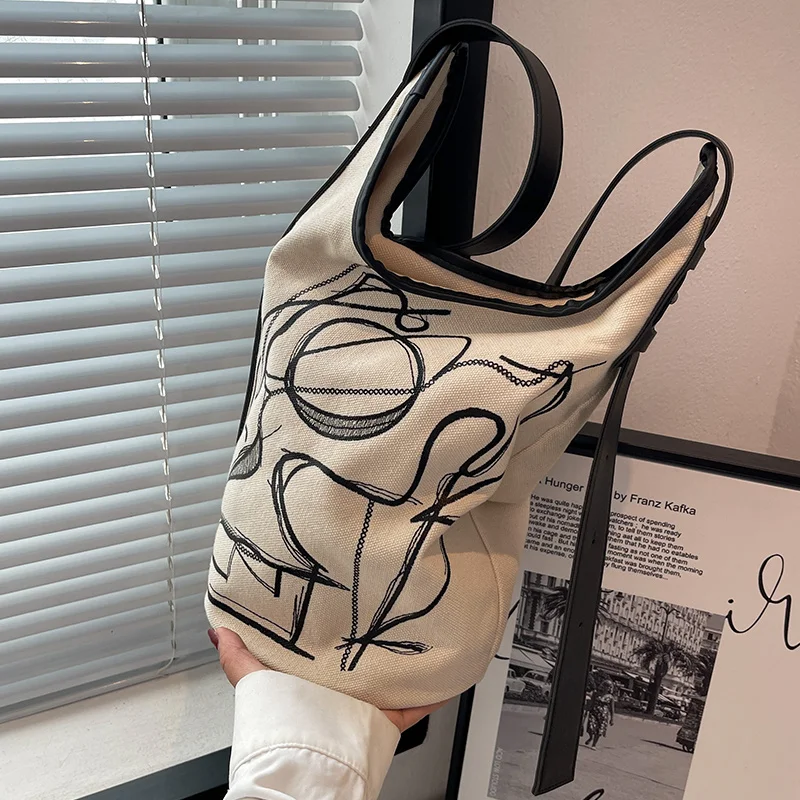 

Large capacity net red envelope women's 2022 new summer canvas Fashion Shoulder bag leisure messenger versatile Bucket Bag