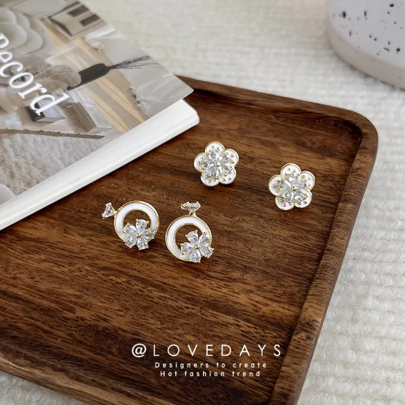 

Minar Elegant Shiny CZ Cubic Zirconia Flower Earring for Women White Color Enamel Hollow Circle Stud Earrings Wedding Jewelry