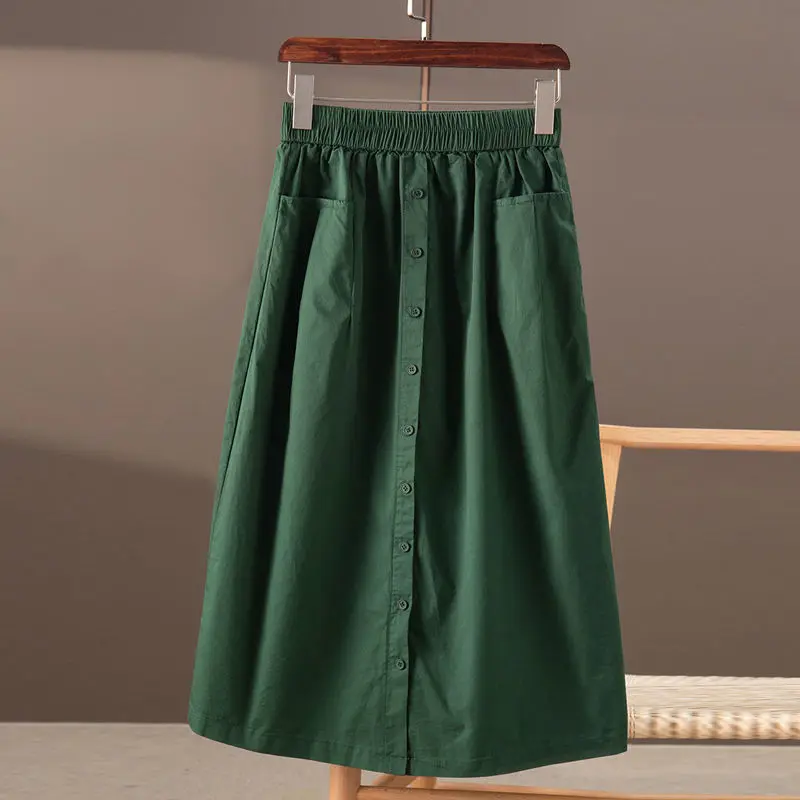 Literature and art leisure solid color elastic waist A-line skirt women  Korean fashion splicing single breasted skirt women
