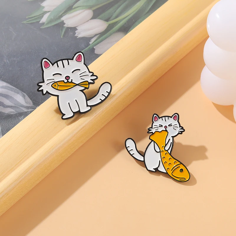 

Fish Eating Cat Enamel Pins Custom Cute Cats Greedy Fish Series Brooch Lapel Metal Badge Bag Animal Jewelry Gift for Kid Friend