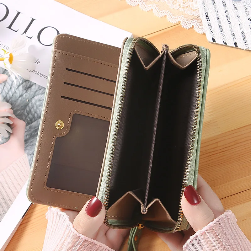 New solid color ladies wrist strap clutch bag fashion Korean version of the long women's zipper wallet large wallet wholesale.