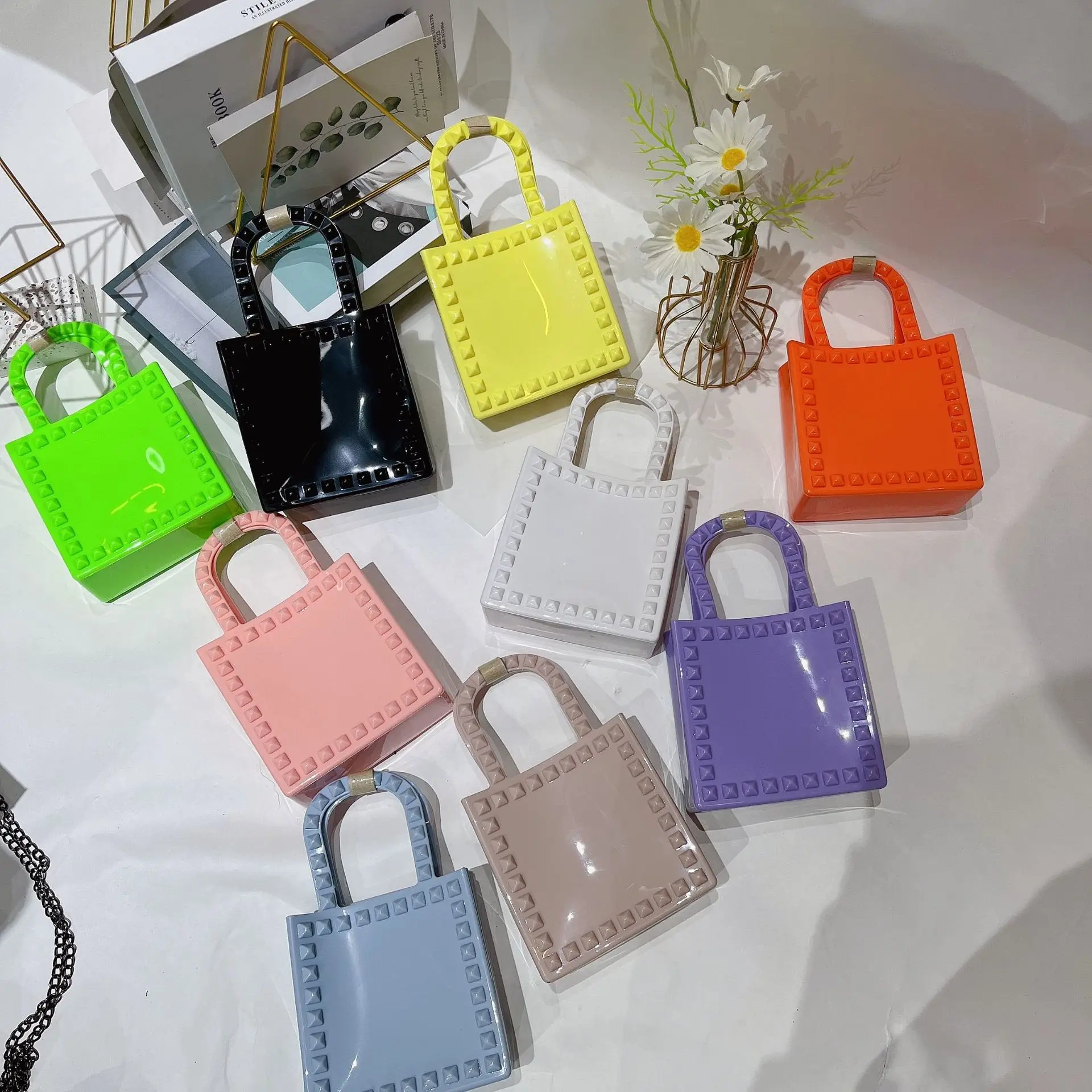 

2023 Spring/Summer New PVC Jelly Women's Mini Fashion Rivet Small Square Shoulder Oblique Cross Wrist Bag