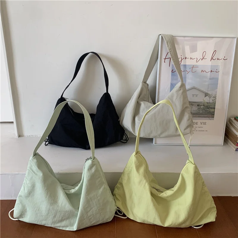 

Japan and South Korea new one shoulder large capacity nylon drawstring shopping bag armpit bag commuter tot women's bag simple