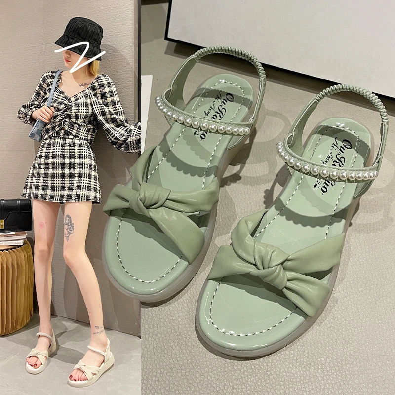 

Sandals women's flat shoes 2022 new fairy style net celebrity pearls with skirt summer fashion Roman beach shoes